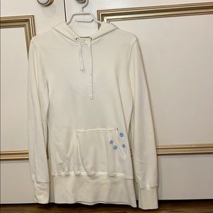 White long-line TNA hoodie with blue details
